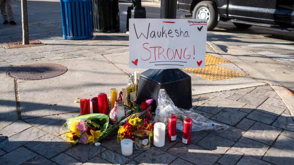 A makeshift memorial to the victims of the Waukesha Christmas parade attack