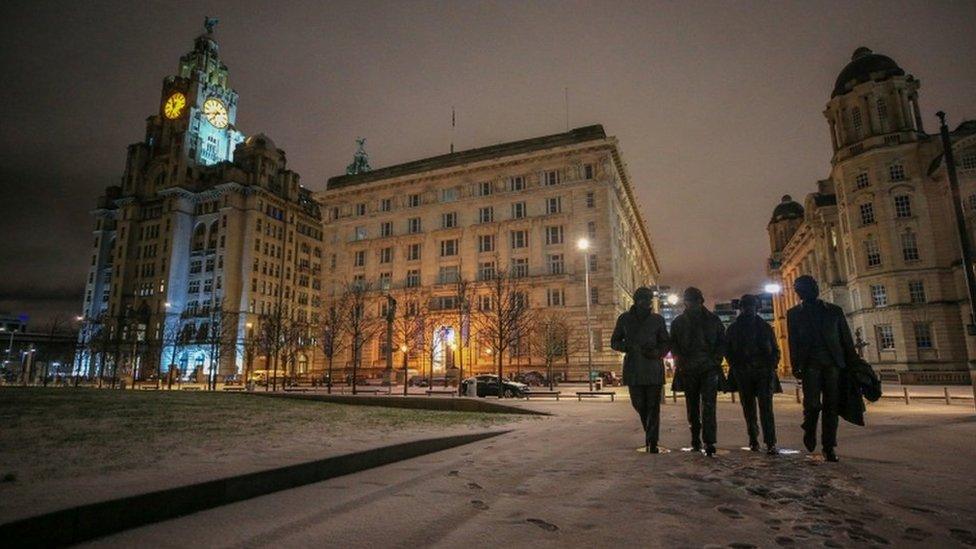 Overnight snow surrounds the statue of the Beatles in Liverpool on the day that forecasters predicting "very significant snowfall" this week, with temperatures expected to plunge to at least minus 10 degrees Celsius (14F) in some parts of the country