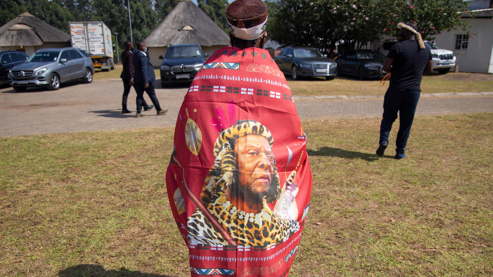 A woman wearing a wrap with the image of Zulu King Goodwill Zwelithini in Nongoma, South Africa - 18 March 2021