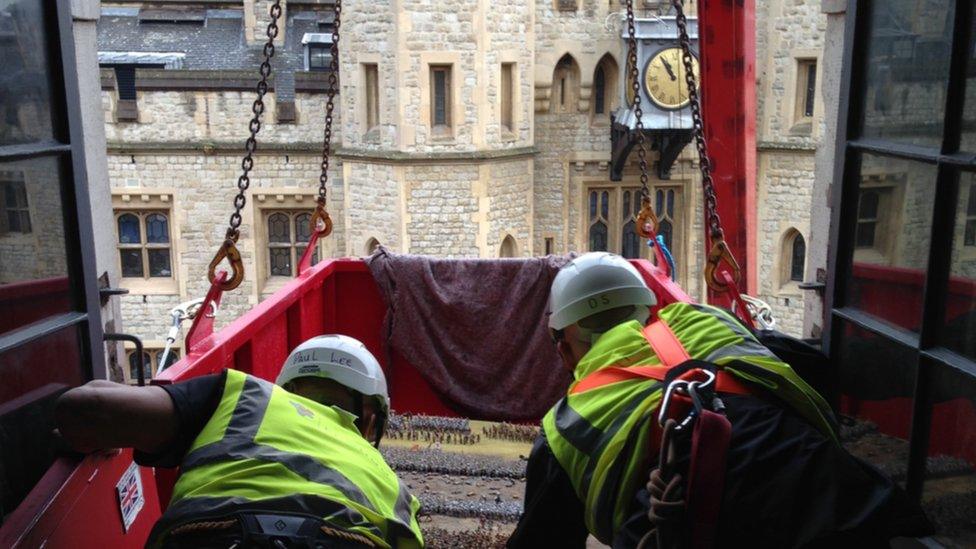 Agincourt diorama being winched into the room