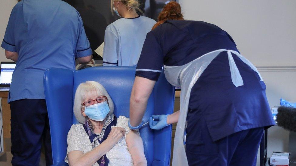 Resident Margaret Keating, 88, receives the Pfizer/BioNTech COVID-19 vaccine at the Abercorn House Care Home in Hamilton, Scotland, Britain December 14, 2020.