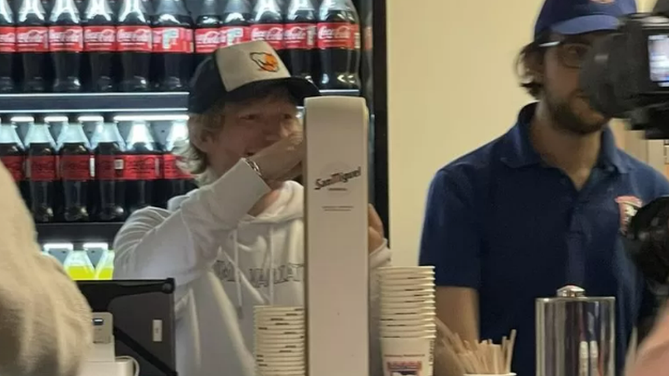 Ed Sheeran pulling pints at Portman Road