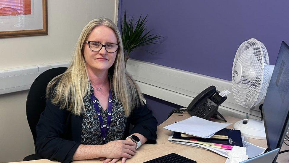 Geraldine Hanna at her desk