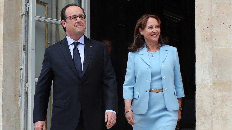 French President Francois Hollande (L) and French Environment Minister Segolene Royal (C) visit an exhibition during a ceremony marking the first anniversary of the energy transition law, at the Elysee Palace, in Paris, on July 22, 2016.