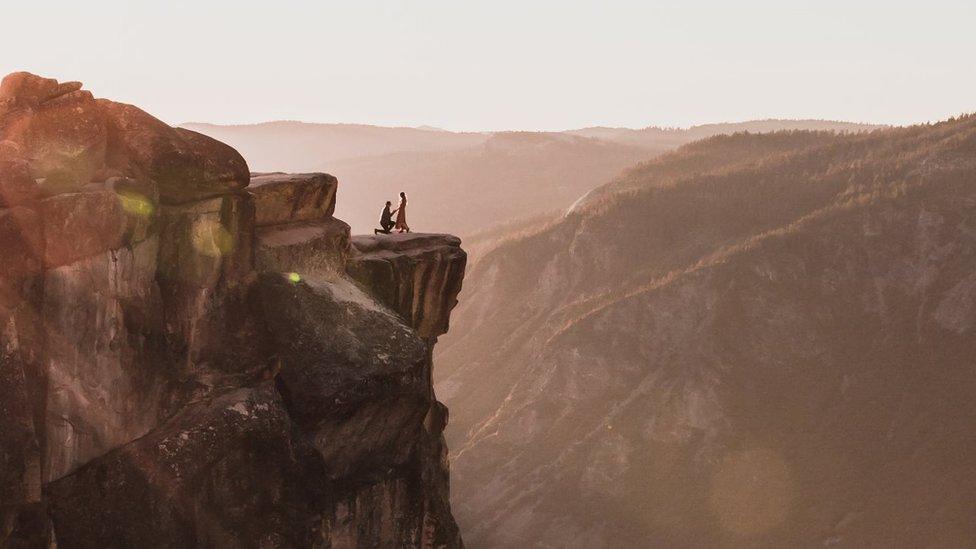 Thumbnail shot of the couple on the cliff-edge