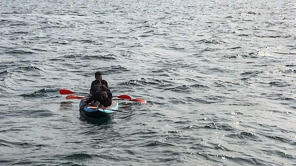 Three migrants trying to cross the English Channel