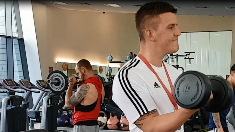 Daniel Flaherty lifting weights in the gym