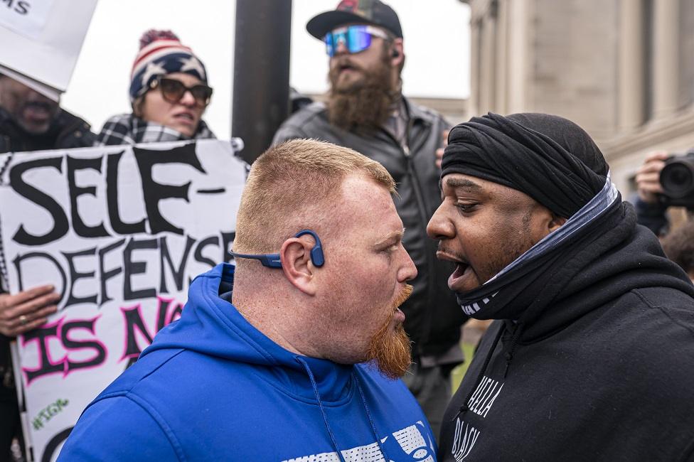 Two men argue outside court