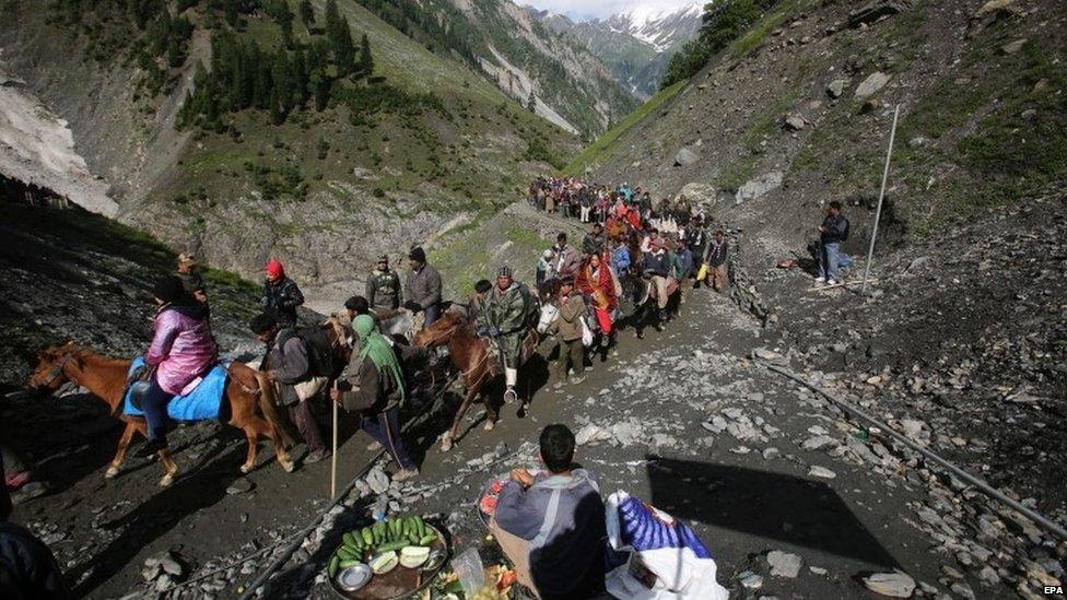 Indian Hindu pilgrims cross mountain trails during their religious journey to the Amarnath cave, on the Baltal route, some 125 kilometers northeast of Srinagar, Jammu and Kashmir, India, 02 July 2015. Hindus believe the cave to be an abode of the god Shiva. The 59-day annual Amarnath yatra pilgrimage started 02 July 2015