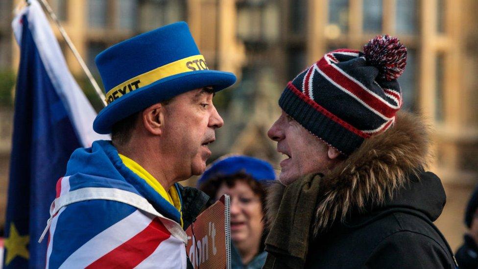 Anti-Brexit and pro-Brexit protestors argue outside the Houses of Parliament