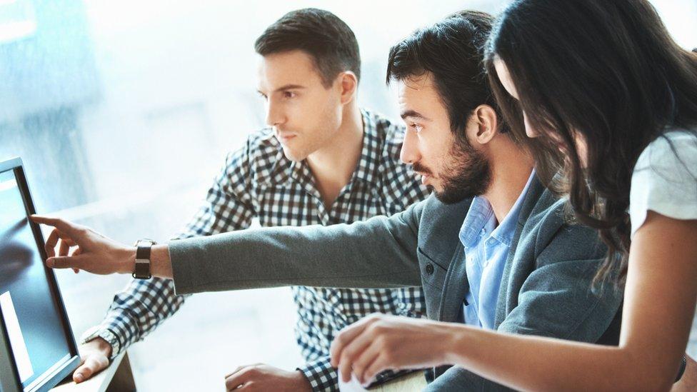 People looking at a screen