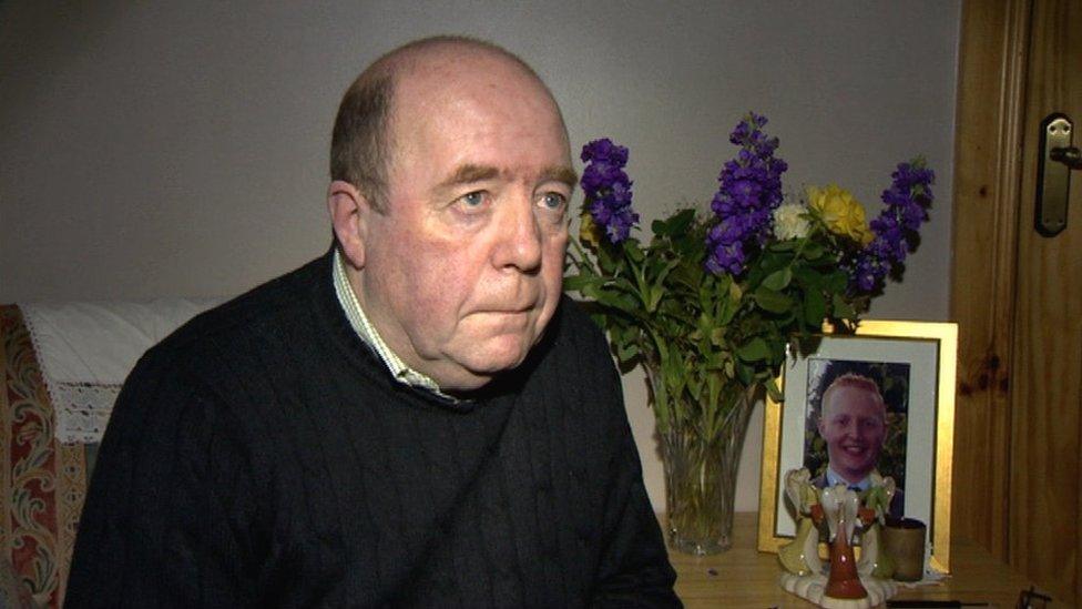 Colin Bell with a photo of his late son, Kevin