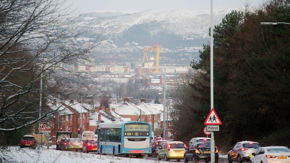 Traffic making its way into a snowy Belfast