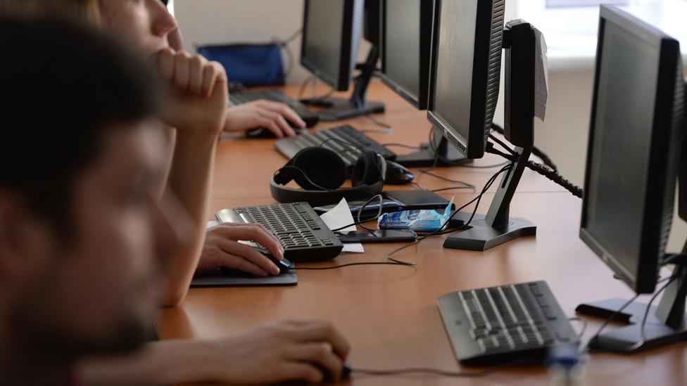 Teenagers using computers