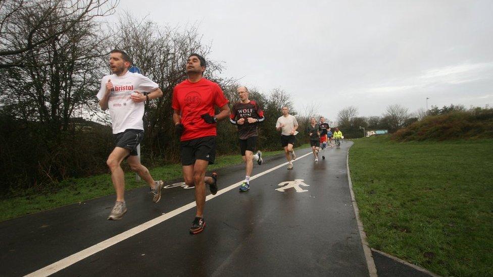 Runners in Little Stoke Park near Bristol