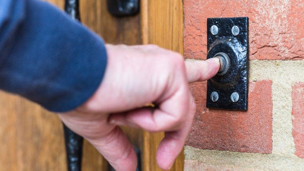 Doorbell being pressed