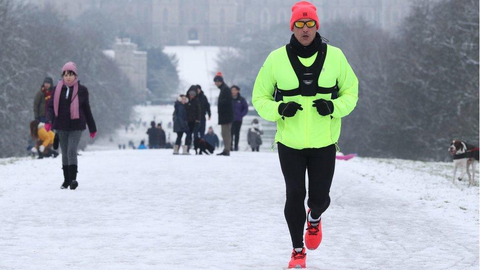 A jogger braves at Windsor Castle, Berkshire