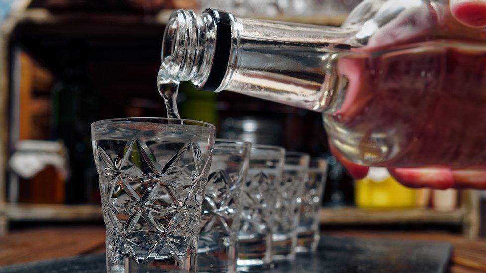 Vodka poured into glasses