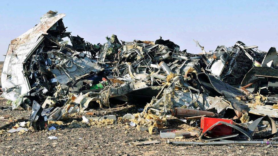 Debris from crashed Russian jet lies strewn across the sand at the site of the crash, Sinai, Egypt, 31 October 2015.