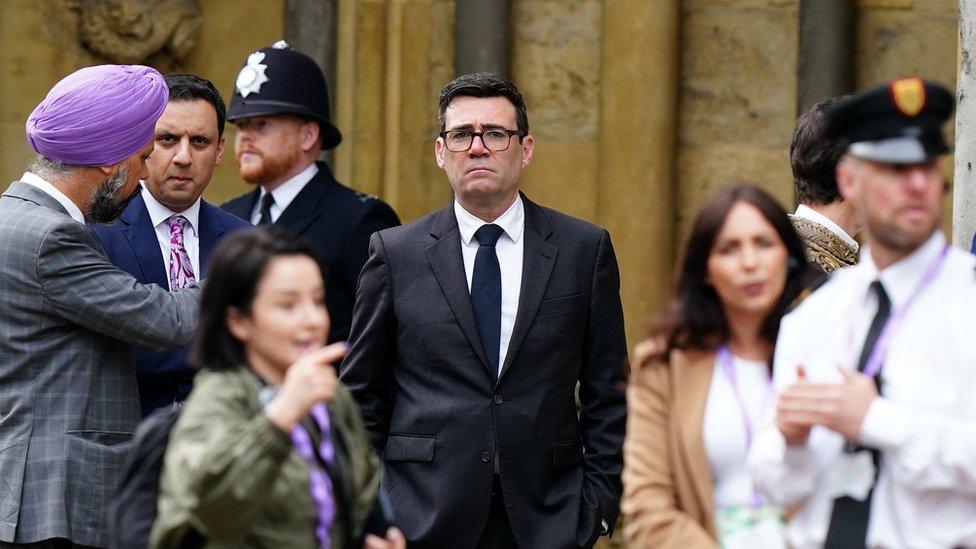 Andy Burnham waiting outside the Abbey