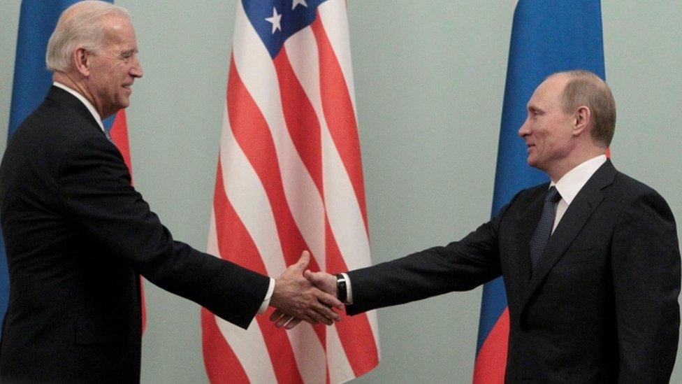 Biden and Putin shake hands