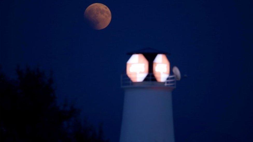 A picture shows the full moon during a "blood moon" eclipse as seen from Tirana on July 27, 2018.