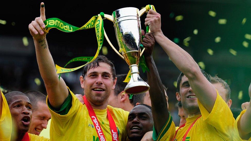 Grant Holt with the Championship trophy