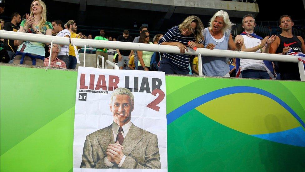 A poster showing a likeness of Ryan Lochte of USA with the caption "Liar Liar 2, starring Ryan Lochte" is seen at the Rio athletics stadium (19 August 2016)