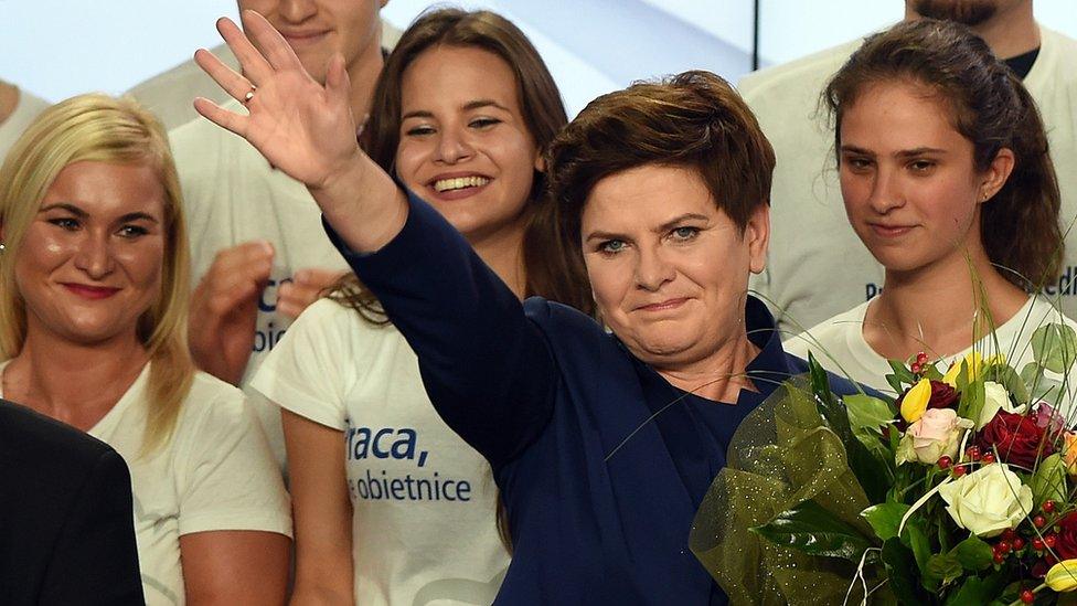 Beata Szydlo, candidate for prime minister of Law and Justice celebrates with supporters after exit poll results projected an absolute majority win for the party.