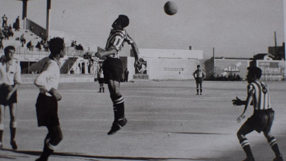 Mohamed Maouche heading a football