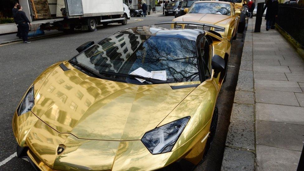 Fleet of gold cars in Knightsbridge