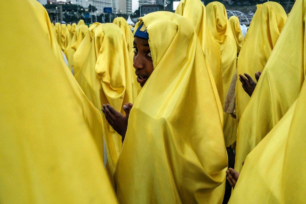 People dressed in yellow