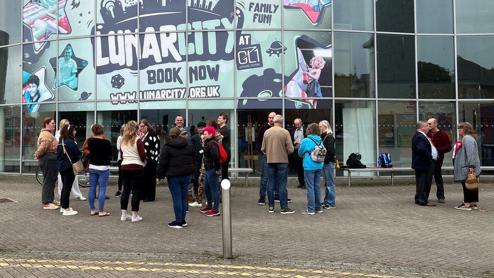 Protestors gathered outside of the GL1 leisure centre