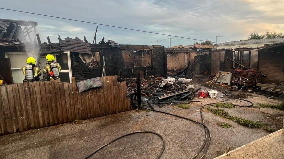 Bungalow fire being extinguished by fire crews