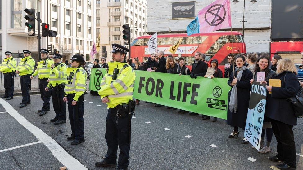 Police and protestors at London Fashion Week