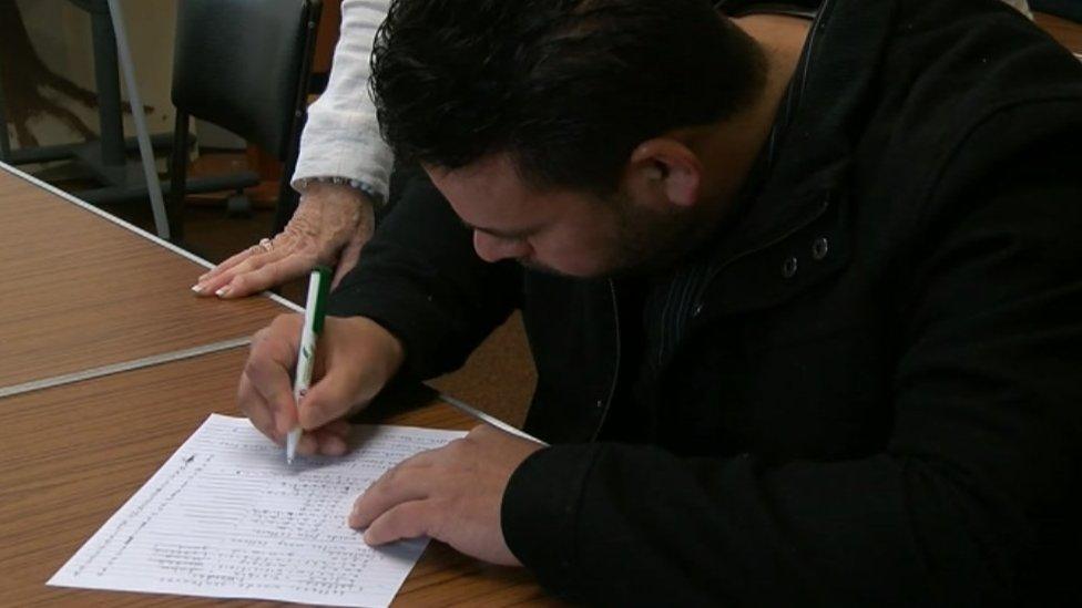 Refugee at an English language class