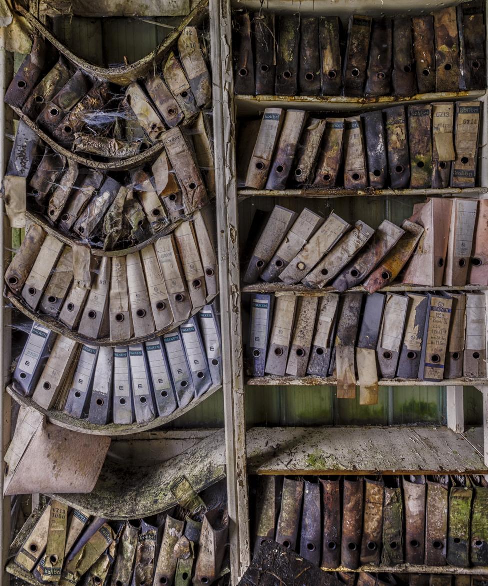 Sagging shelves with files on them