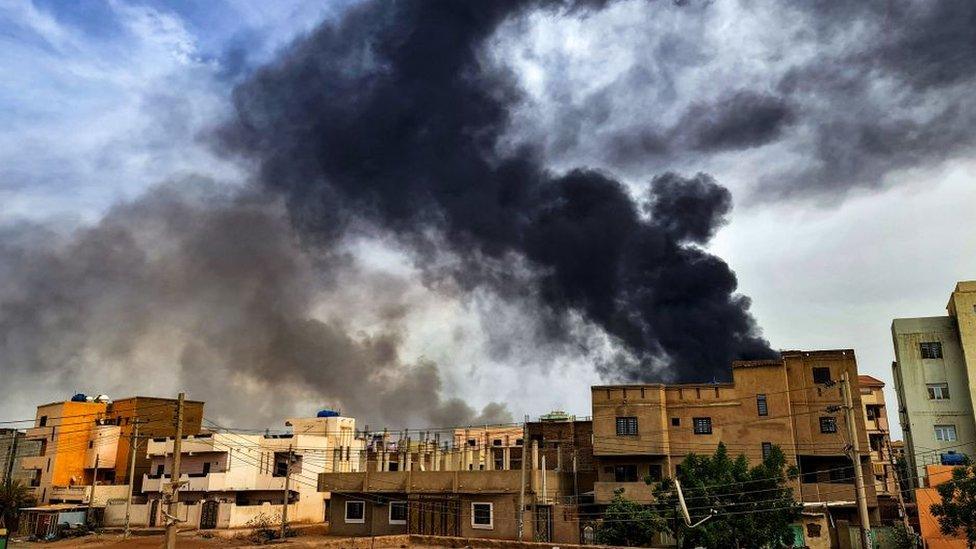 Smoke plumes billow from a fire at a lumber warehouse in southern Khartoum amidst ongoing fighting on June 7, 2023.