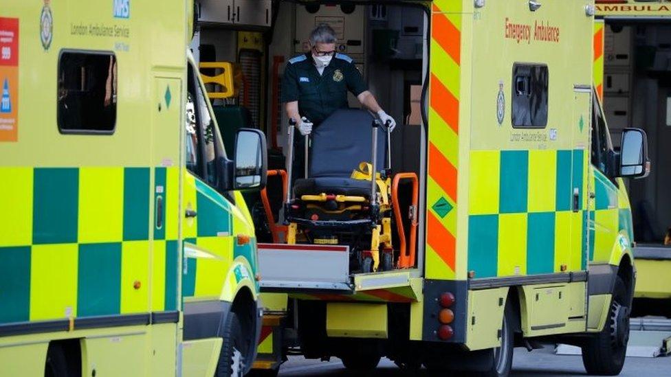 Paramedics wearing PPE outside the Royal London Hospital in east London