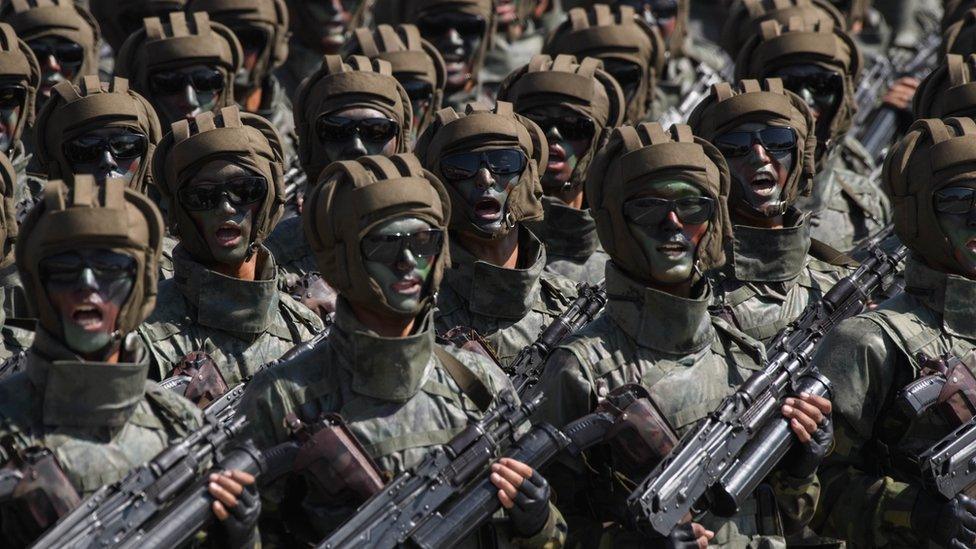 Korean People's Army (KPA) soldiers march during a mass rally on Kim Il Sung square in Pyongyang