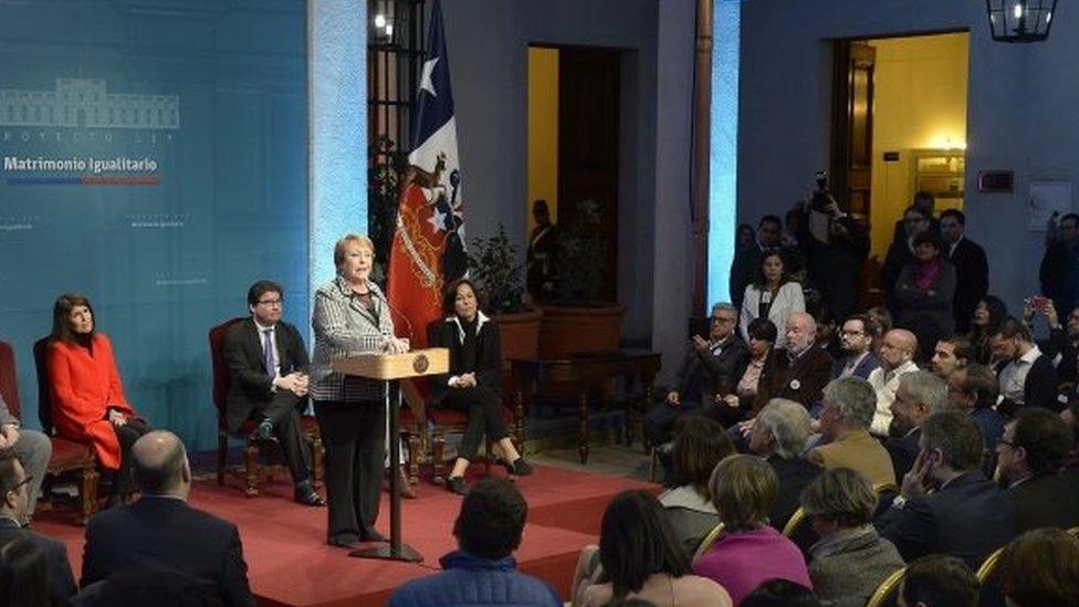 A handout photo made available by the Presidency of Chile shows Chilean President Michelle Bachelet as she presents a bill she signed today to guarantee marriage equality, at La Moneda Palace in Santiago, Chile, 28 August 2017