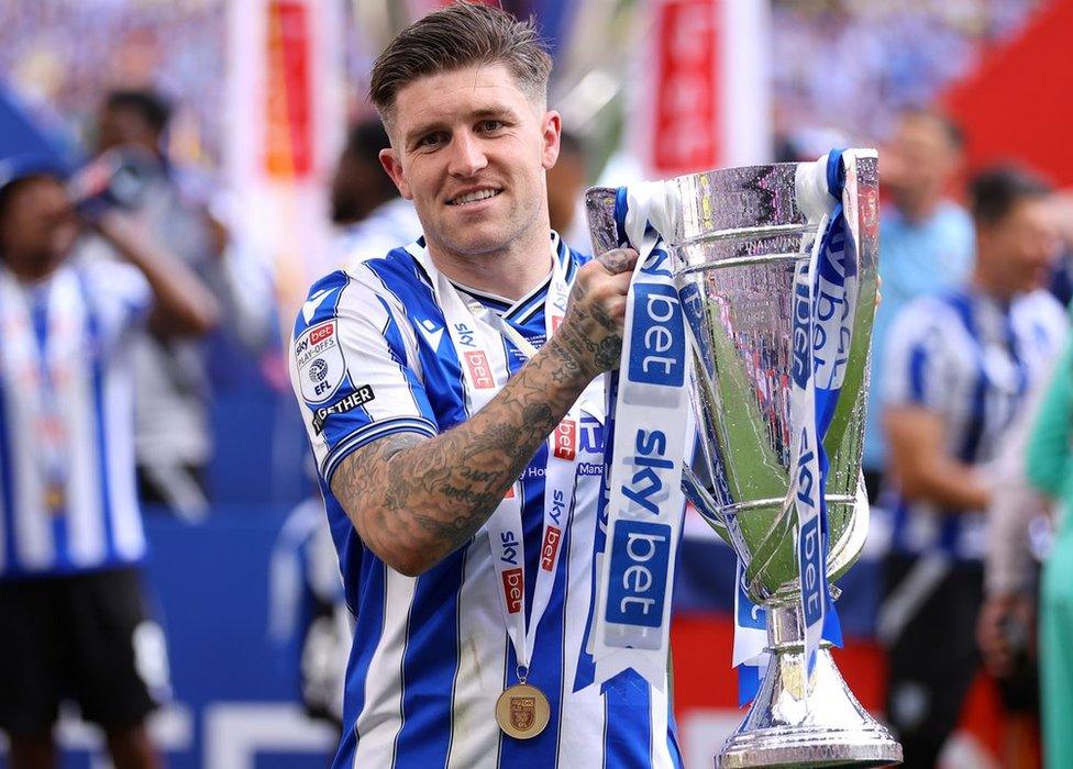 Wembley hero Josh Windass celebrates with the trophy