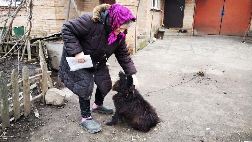 Lyubov Kolyucha and her dog Sharik