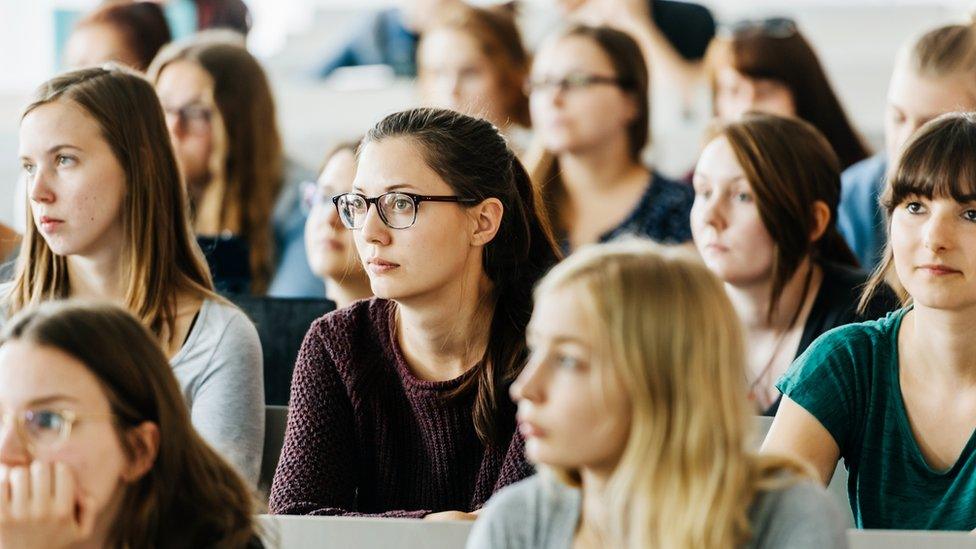 Women in university lecture hall