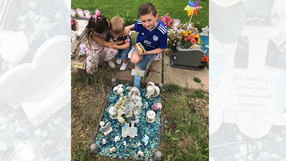 Laura Williams's children Morgan, 10, Keeley, eight, and Rueben, two, at Leo's grave