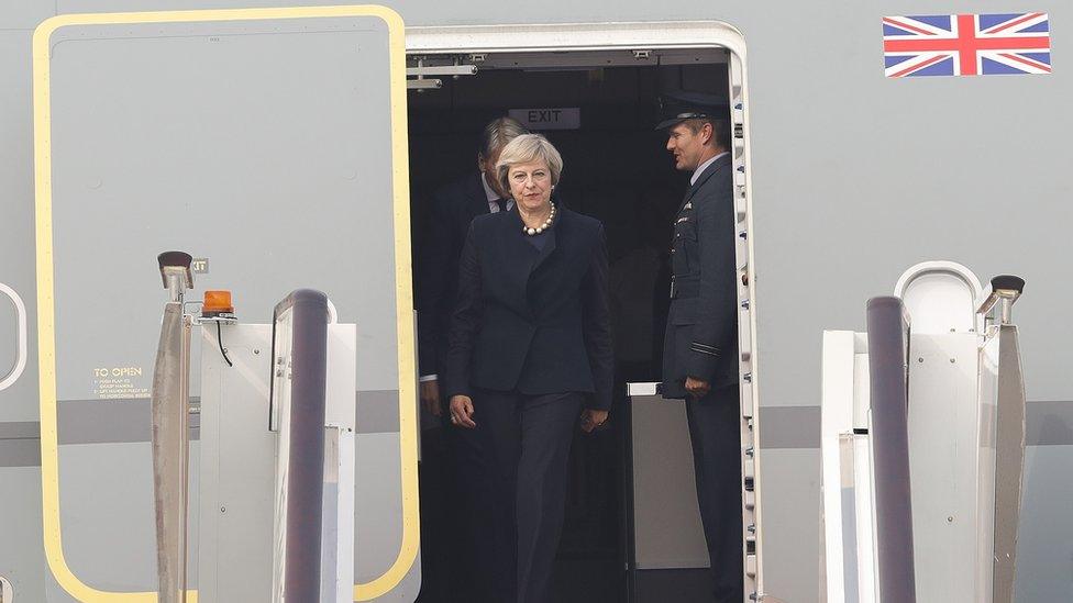 Theresa May arriving in China