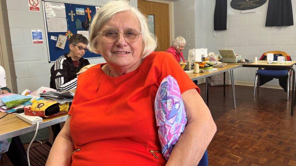 Julie Wood with one of the cushions for people with breast cancer