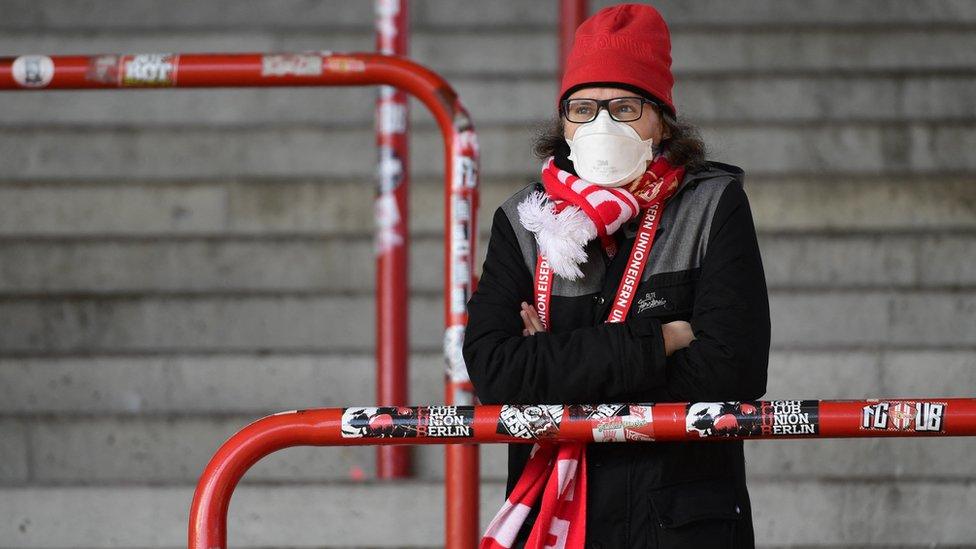 FC Union Berlin fan wearing a protective face mask in the stand as coronavirus (COVID-19) restrictions