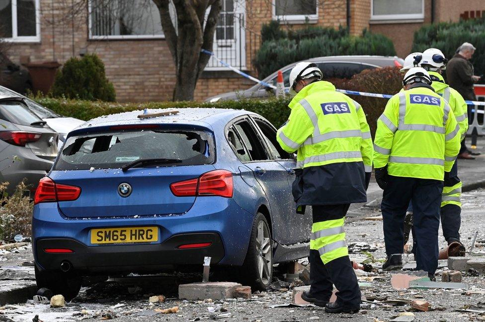 Gas engineers and police officers at the scene