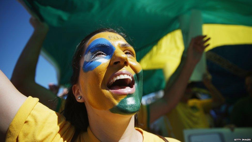 A protester calling for the impeachment of President Dilma Rousseff cheers along Copacabana beach on 16 August 2015